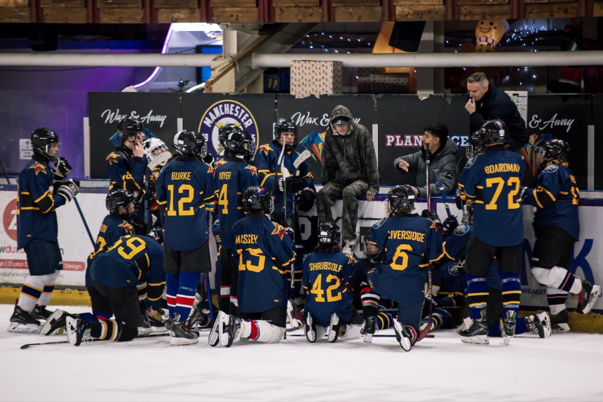 Faisal Alasseri coaching the Manchester Metros D team from the bench